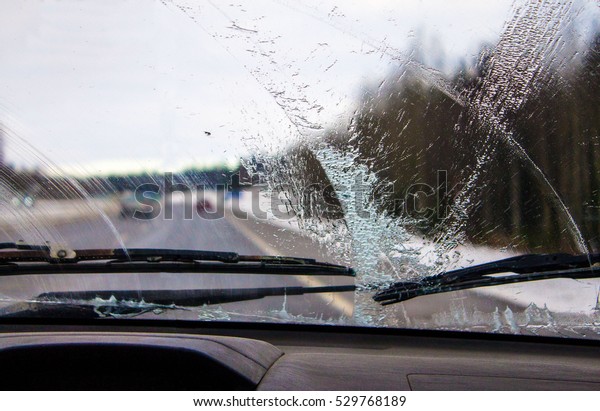 The view from the car. Behind the glass on\
the road. To travel in the car.Sink\
glass