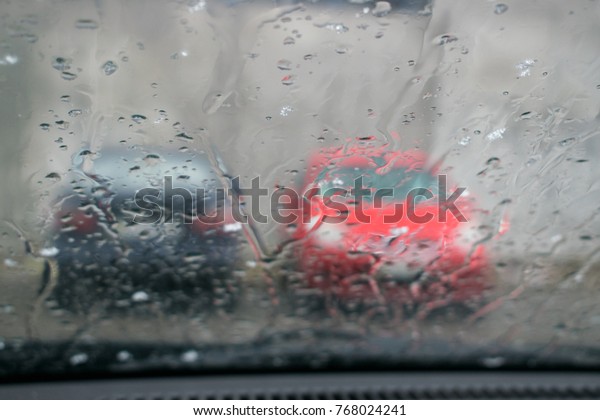 View from the car in the\
rain.
