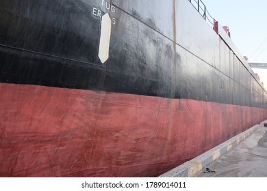 View Of Cargo Ship Side Hull Shell Plating Of Red And Black Color