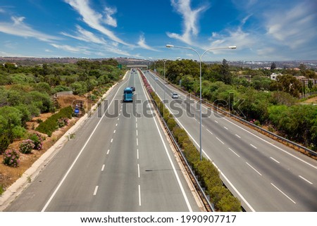 View of cars and buses driving highway close to Larnaca, Cyprus.