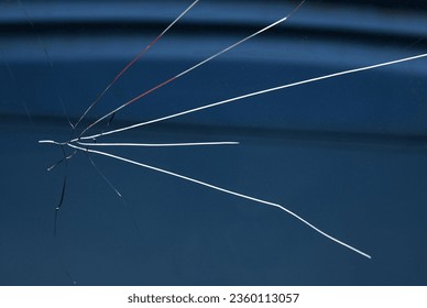 A view of a car's shattered windshield. - Powered by Shutterstock