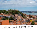 View of Castelo de São Jorge, and colorful facades of buildings, Lisbon. Capital of Portugal. Main tourist attraction of Lisboa