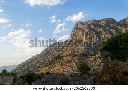 A view of a castle wall on a rocky mountain at Kotor Bay in Montenegro