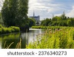 View of the Cathedral of Amiens from the banks of the River Somme in the famous Hortillonnages of Amiens in Picardy, France