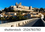 View of Cathedral of Saint Nazaire across Orb river, Beziers, France