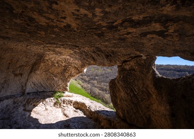 View from the cave through the gap to the valley.