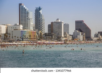 View of the Central beach of Tel Aviv and the enbankment on a bright Sunny may day when many swimmers. Israel