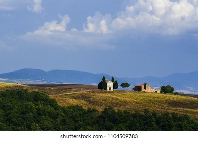 View of Chapel and farmhouse in Tuscany, Italy. - Shutterstock ID 1104509783