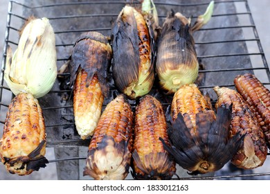 
View Of Charcoal Grill With Burnt Roasted Corn