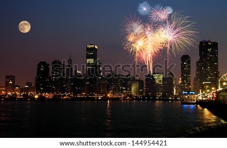 View of Chicago downtown and Navy Pier with grand fireworks and super moon
