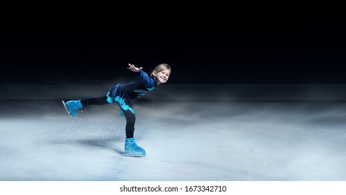 View Of Child  Figure Skater On Dark Ice Arena Background