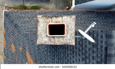 A view of a chimney from above looking straight down the flue.