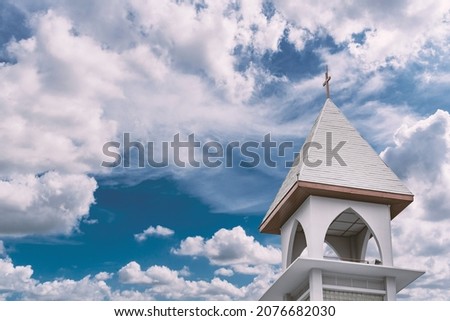 View of the Christian church and blue sky with clouds background
