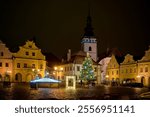 View of the Christmas-decorated Masaryk Square in Pelhrimov, in the background the tower of the Church of St. Bartholomew