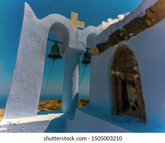 A View From A Church Bell Tower Beside The Castle Ruins In Pyrgos, Santorini In Summertime