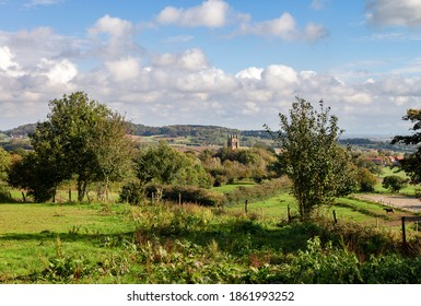 View Of The Church Of Loker With The Kemmelberg In The Background. Belgium.