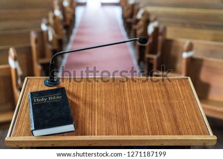 view of church pulpit with bible on it, overlooking the church