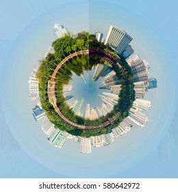 View Circle Of Metropolis Building With The Green Park And Blue Sky , The City Park Reflection From Water In Lake.