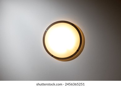 View of circular ceiling light from directly below