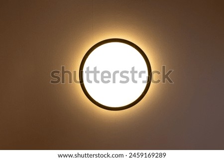 View of circular ceiling light from directly below