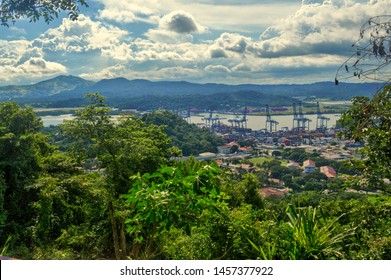 View Of City And Canal Of Panama From The Hill Ancon. Beautiful Panoramic View From Cerro Ancón In Panama. Mountains And Blue Sky With Clouds On The Horizon