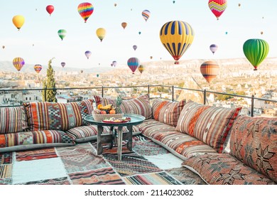 View of the city of Goreme with caves and air baloons in Cappadocia. Fabulous landscapes of the mountains of Cappadocia Goreme, Turkey