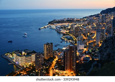 View Of The City Of Monaco By Night. French Riviera