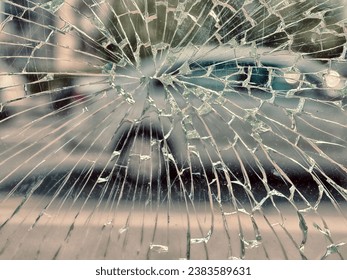View of city and people through cracked glass. City as habitat with increased danger, mental stress concept (environmental stress, riots, accidents, risky transport, diseases, maniacs, terrorism etc.)