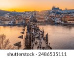 View of the city of Prague castle in hradcany and the Vltava river with Charles bridge from Old Town Bridge Tower in Prague, Czech Republic.