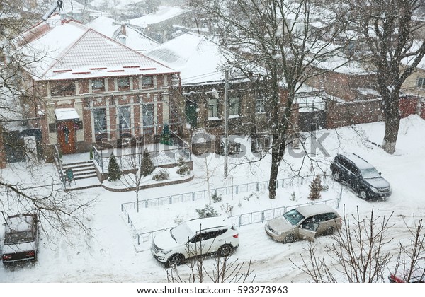 View of city street\
with cars in winter
