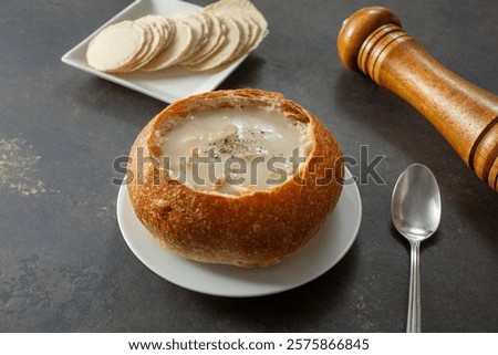 A view of a clam chowder bread bowl.
