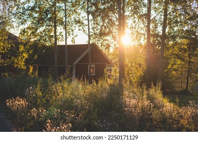 View of classical finnish landscape with traditional wooden red cabin cottage houses and camping site, Uusimaa, Southern Finland in a summer sunny day - Shutterstock ID 2250171129