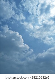 A view of a clear sky with thick and fluffy cumuliform cloud formations.
The bright blue sky color contrasts with the clean white clouds spread across most of the frame. 