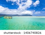 View of the clear turquoise waters of Kaneohe Bay as seen from the iconic sandbar in Oahu, Hawaii with the famous Chinamen