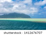 View of the clear turquoise waters of Kaneohe Bay as seen from the iconic sandbar in Oahu, Hawaii with the famous Chinamen