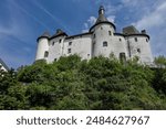 View of Clervaux Castle (Chateau de Clervaux) in Clervaux in Northern Luxembourg, dates back to XII century. Castle stands at a height of 365 meters on a rocky spur above town. Clervaux, Luxembourg.