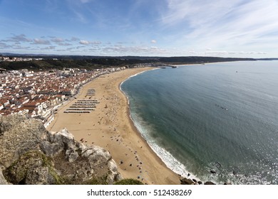 View from the cliff called Sitio of the fishing village and beach of Nazare, Portugal - Shutterstock ID 512438269