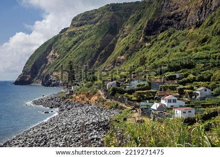 View of cliffs and settlement Rocha da Relva, southwest coast, island of Sao Miguel, Azores, Portugal