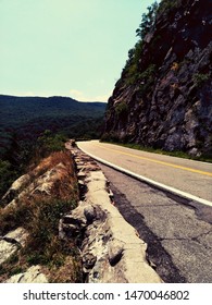 View Of A Cliffside Road During Summer.