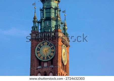 View of the clockface on the Main Town Hall, also known as the Main City Hall, in the city of Gdansk, Poland.