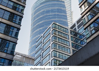 The view of the close constructed modern office buildings in the financial district. Glass towers in downtown of the city. A cluster of tall buildings. - Shutterstock ID 2173413119