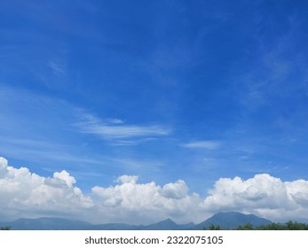 view of clouds and adjacent mountains