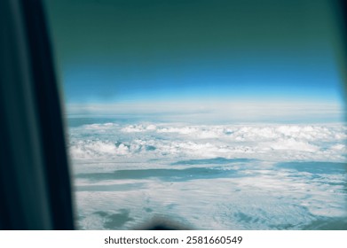 View of clouds from airplane window, background with clouds.