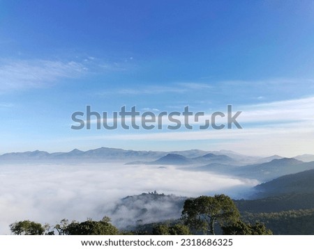 A view of clouds descending the moutains . hill station located at vizag