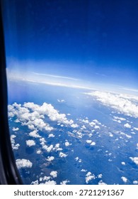 “A View of Clouds as Far as the Eye Can See from the Airplane Window