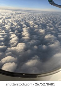 View of clouds from plane window 