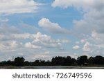 View clouds in the sky before rain falls over residential areas in the watershed.