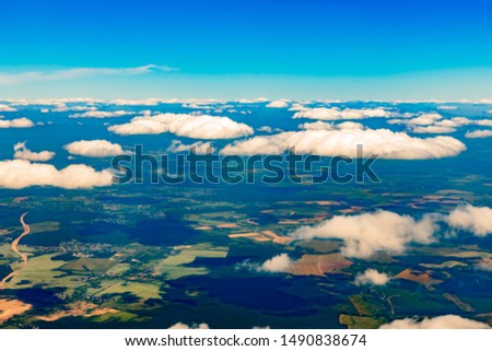Аerial view of clouds and village landscape.