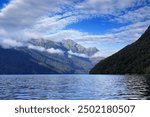 view to the cloudy mountains of the Doubtful Sound in Fiordland, south west of New Zealand