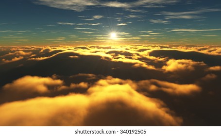 View of a cloudy sunrise while flying above the clouds.